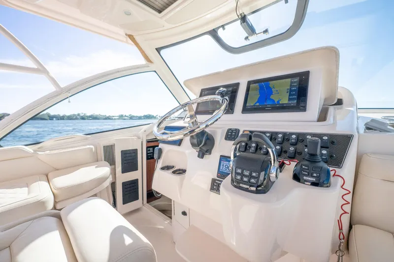 Meant To Be Yacht Photos Pics 2018 Grady-White Express 330 boat cockpit with modern navigation equipment and steering wheel.