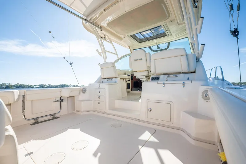 Meant To Be Yacht Photos Pics 2018 Grady-White Express 330 boat interior with seating and storage, under clear blue sky.