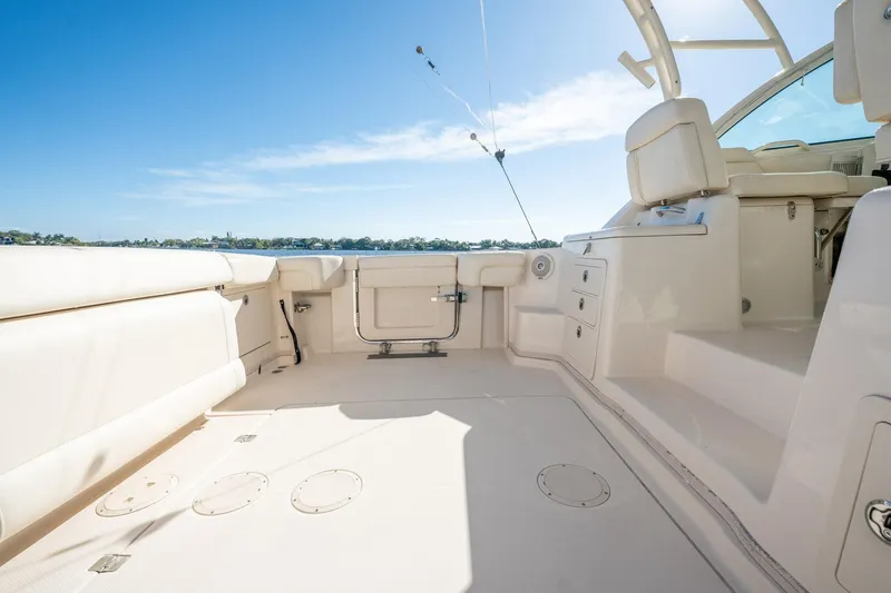 Meant To Be Yacht Photos Pics 2018 Grady-White Express 330 boat interior with seating and storage, under clear blue sky.