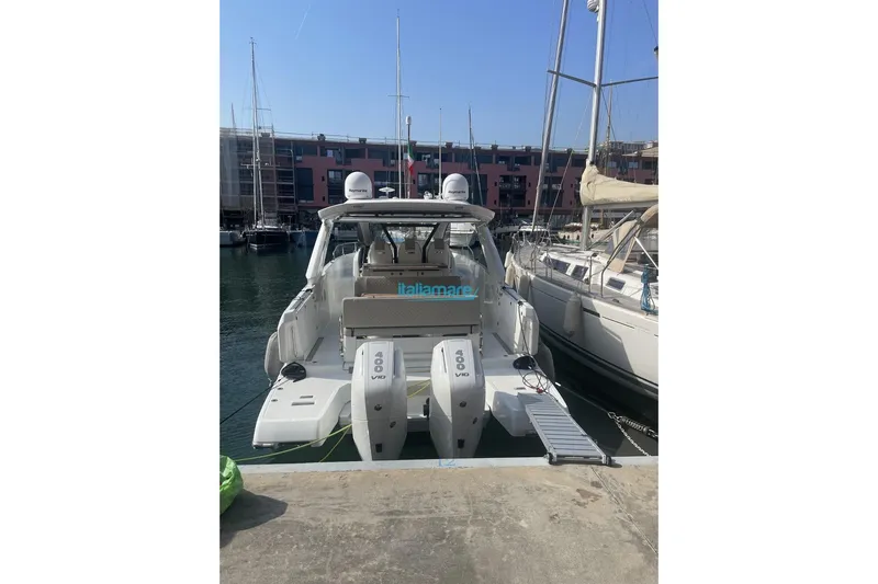 Yacht Photos Pics 2024 Jeanneau DB/37 OB boat docked at a marina, rear view with twin engines.