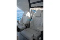 Luxurious seating on the 2024 Jeanneau DB/37 OB boat, with ocean view.