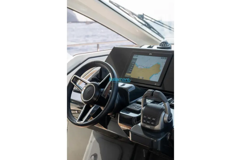  Yacht Photos Pics 2024 Jeanneau DB/37 OB helm with GPS display and steering wheel.