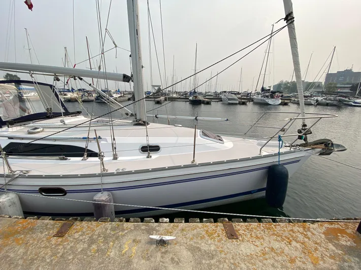  Yacht Photos Pics Catalina 355 sailboat docked at marina, 2014 model, surrounded by other boats.