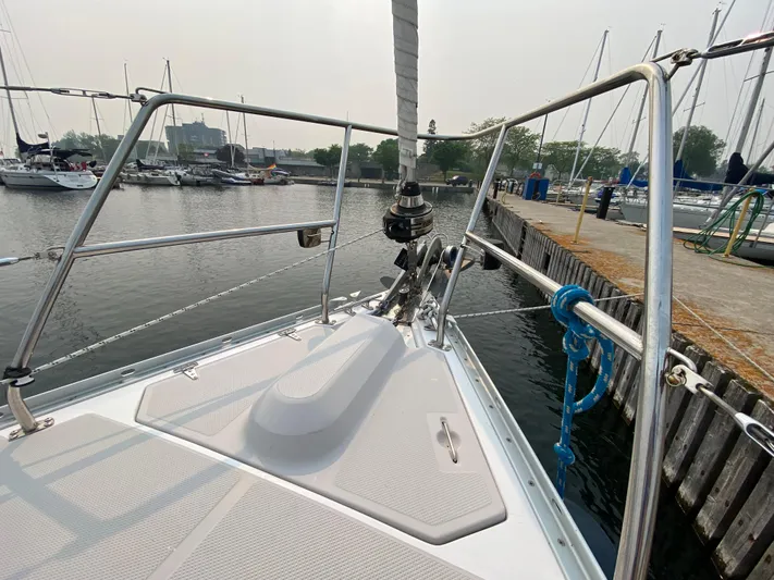  Yacht Photos Pics Bow of a 2014 Catalina 355 sailboat docked at a marina.