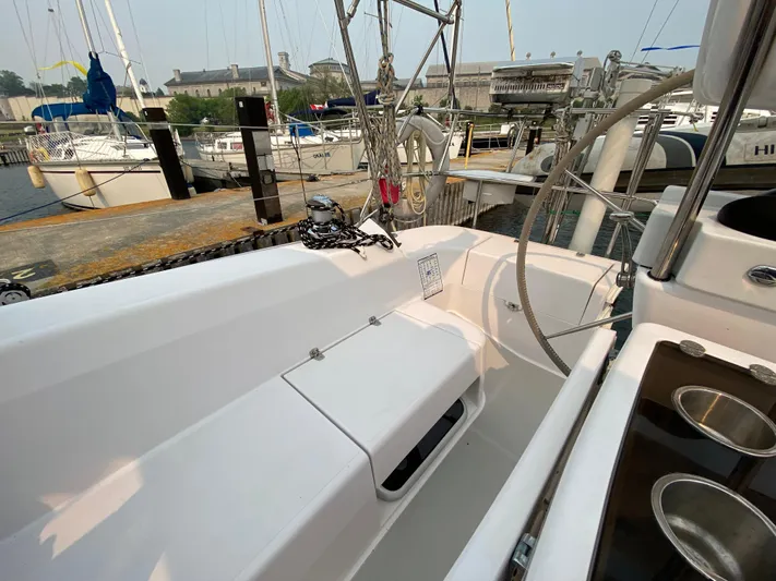  Yacht Photos Pics Cockpit of 2014 Catalina 355 sailboat docked at marina, featuring steering wheel and seating.