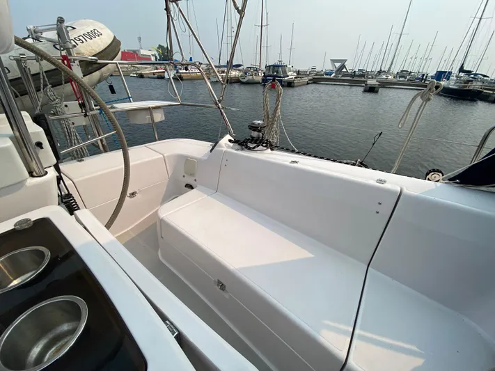  Yacht Photos Pics 2014 Catalina 355 sailboat cockpit with seating and dual sinks, docked at a marina.