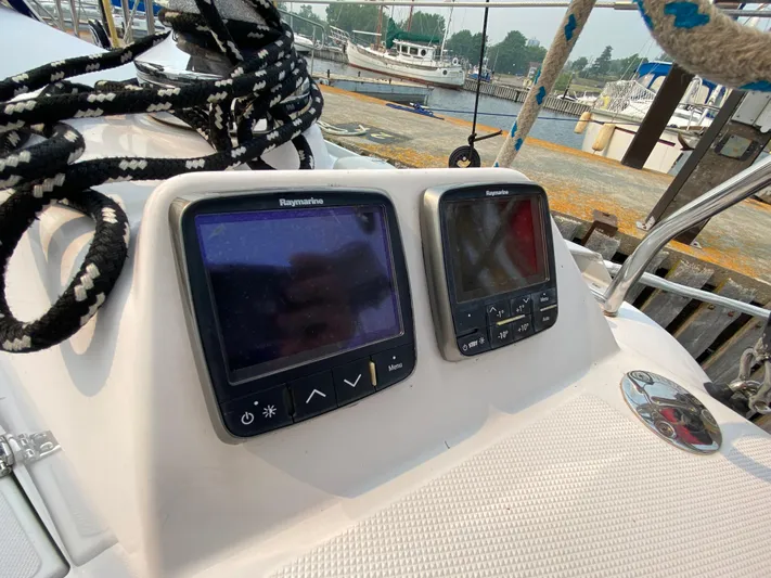  Yacht Photos Pics Catalina 355 sailboat cockpit with navigation instruments, 2014 model, docked at marina.