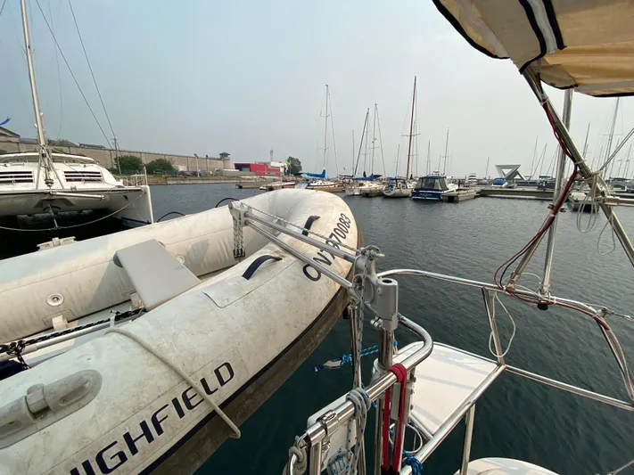  Yacht Photos Pics Catalina 355 sailboat docked at marina with inflatable dinghy, 2014 model.