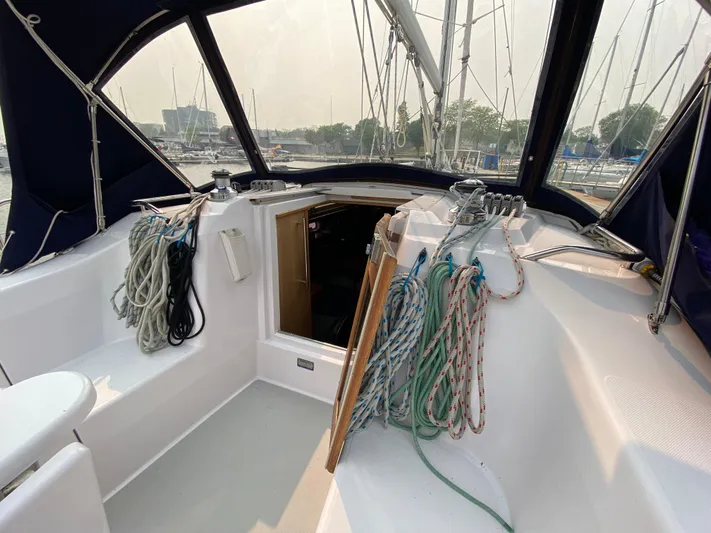  Yacht Photos Pics Cockpit of 2014 Catalina 355 sailboat with ropes and open hatch.