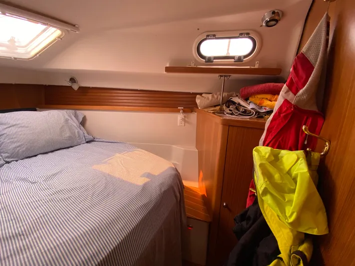  Yacht Photos Pics Cozy cabin interior of 2014 Catalina 355 sailboat with bed and storage.