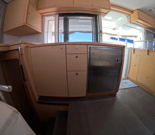 Halia Yacht Photos Pics Interior of 2014 Lagoon 450 yacht with modern kitchen cabinetry and stainless steel appliances.