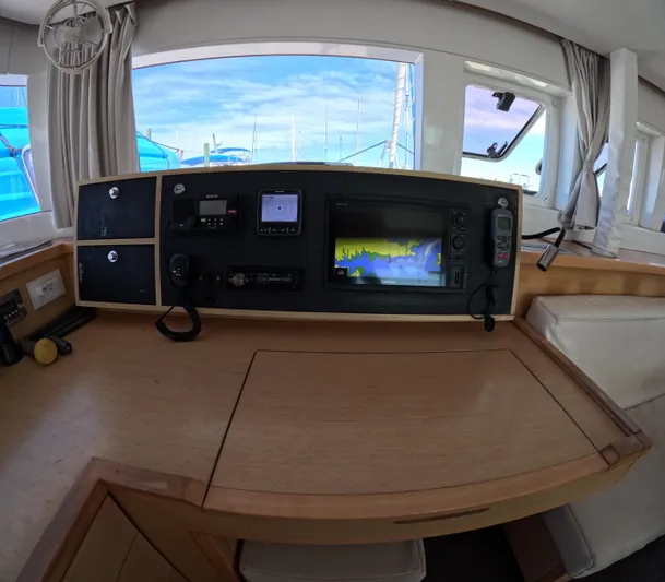Halia Yacht Photos Pics Interior helm station of a 2014 Lagoon 450 catamaran with navigation equipment.