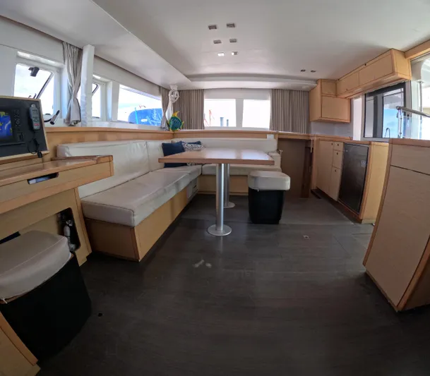 Halia Yacht Photos Pics Interior of 2014 Lagoon 450 catamaran with modern seating and kitchen area.