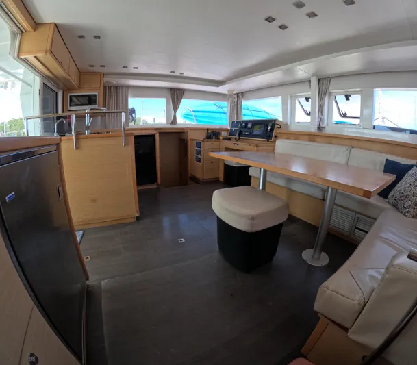 Halia Yacht Photos Pics Interior of a 2014 Lagoon 450 catamaran with modern furnishings and navigation equipment.