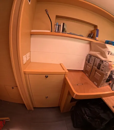 Halia Yacht Photos Pics Interior of a 2014 Lagoon 450 yacht with wooden cabinetry and shelving.