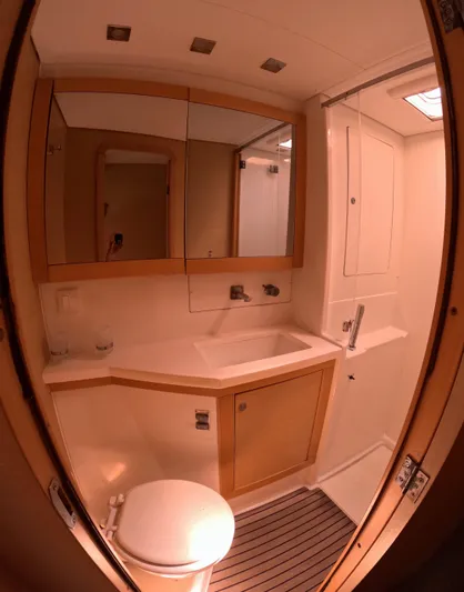 Halia Yacht Photos Pics Bathroom interior of 2014 Lagoon 450 yacht with modern fixtures and wooden accents.