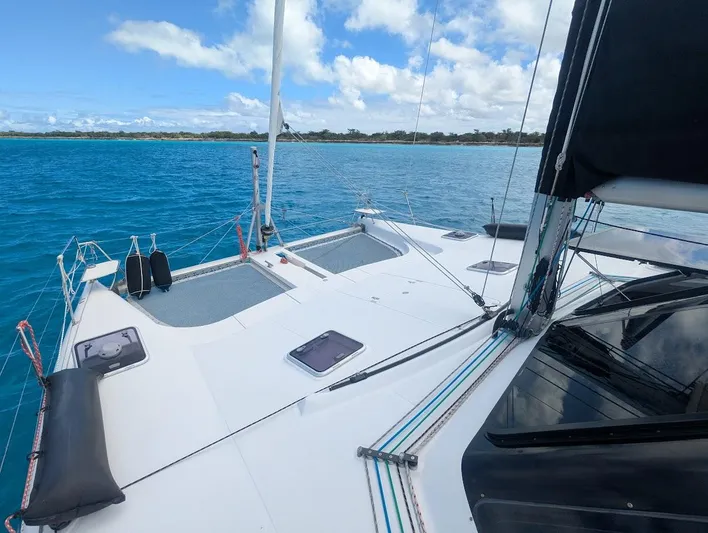 God Speed Yacht Photos Pics Seawind 1260 catamaran sailing on clear blue waters, 2020 model.
