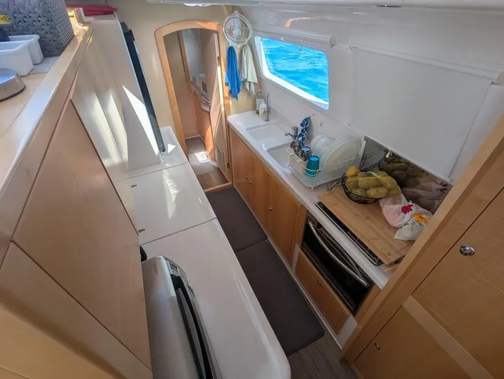 God Speed Yacht Photos Pics Interior of 2020 Seawind 1260 catamaran, featuring a modern kitchen with ocean view.