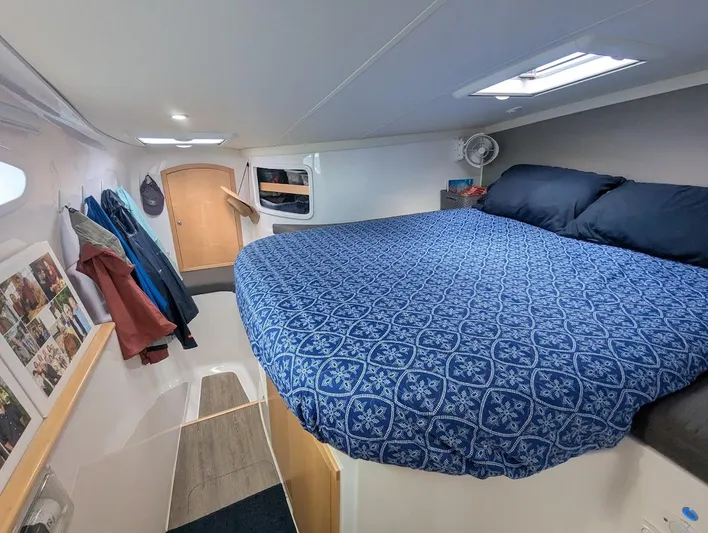 God Speed Yacht Photos Pics Seawind 1260 2020 interior cabin with cozy bed and nautical decor.