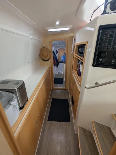 God Speed Yacht Photos Pics Interior of 2020 Seawind 1260 catamaran, featuring modern design and wooden cabinetry.