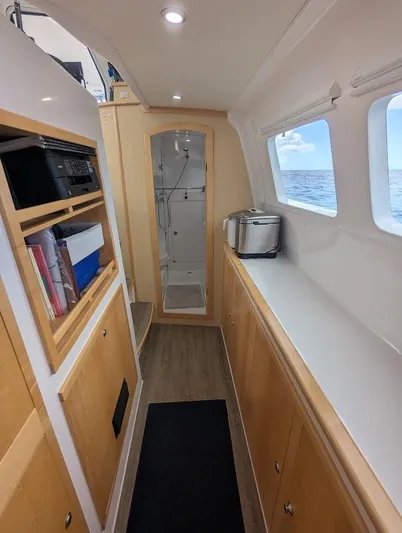 God Speed Yacht Photos Pics Interior of 2020 Seawind 1260 catamaran with modern kitchen and ocean view.