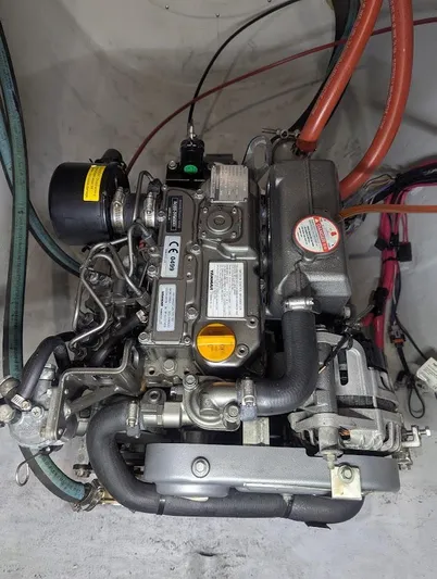 God Speed Yacht Photos Pics Engine of a 2020 Seawind 1260 catamaran, showcasing mechanical components and wiring.