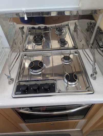 God Speed Yacht Photos Pics Stainless steel stove in a 2020 Seawind 1260 catamaran kitchen.
