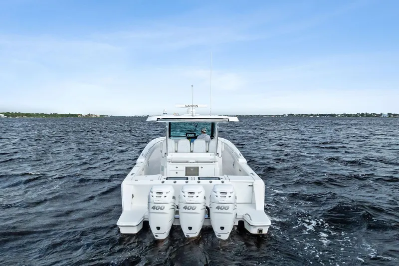 Isla Yacht Photos Pics 2022 Bertram 39 CC boat with triple 400 engines on open water.