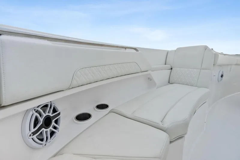 Isla Yacht Photos Pics Luxurious seating on 2022 Bertram 39 CC boat with integrated speakers and cup holders.