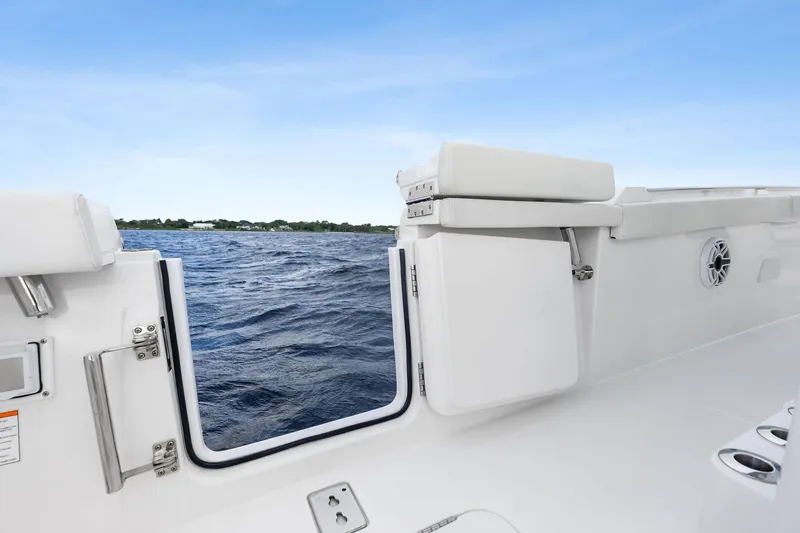 Isla Yacht Photos Pics 2022 Bertram 39 CC boat interior with open side door, ocean view.