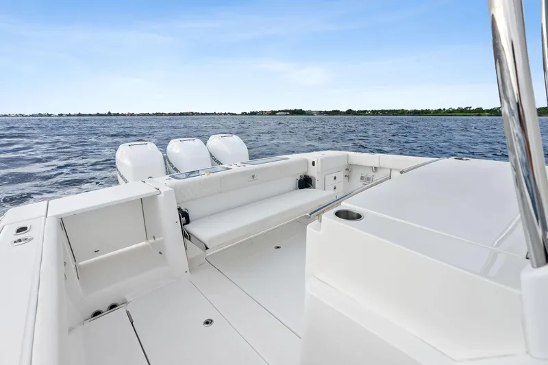 Isla Yacht Photos Pics 2022 Bertram 39 CC boat with triple engines on open water.