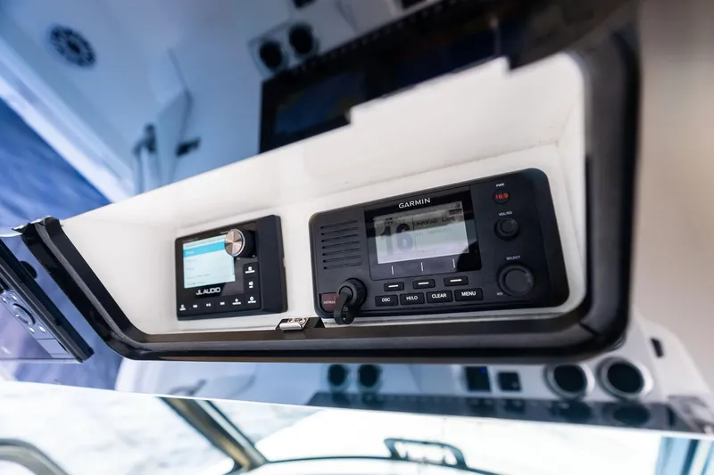 Isla Yacht Photos Pics 2022 Bertram 39 CC boat dashboard with Garmin and JL Audio systems.