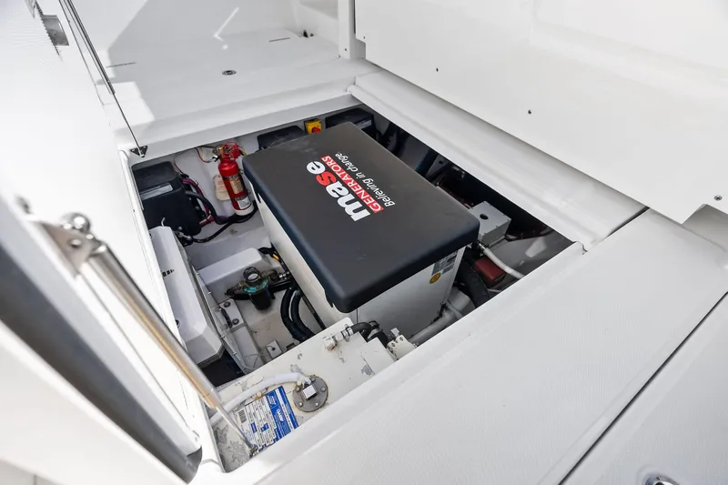 Isla Yacht Photos Pics Engine compartment of 2022 Bertram 39 CC boat with Mase generator and fire extinguisher.
