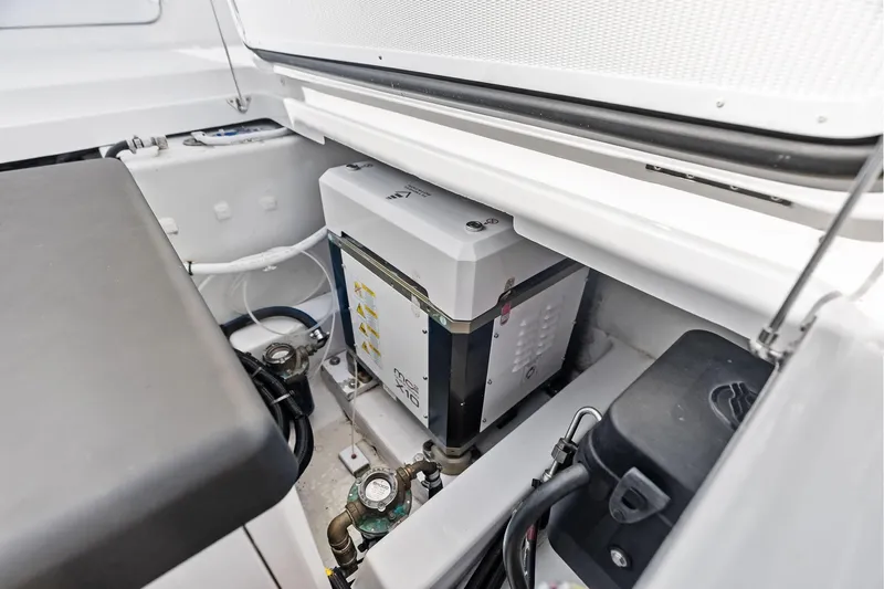 Isla Yacht Photos Pics 2022 Bertram 39 CC engine compartment showcasing modern equipment and wiring.