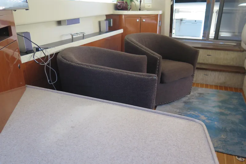  Yacht Photos Pics Interior of 2006 Regal Commodore 3880 yacht with modern seating and wooden accents.