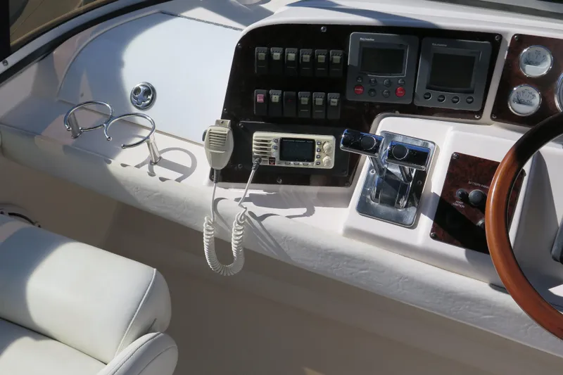  Yacht Photos Pics 2006 Regal Commodore 3880 boat dashboard with controls, gauges, and radio equipment.