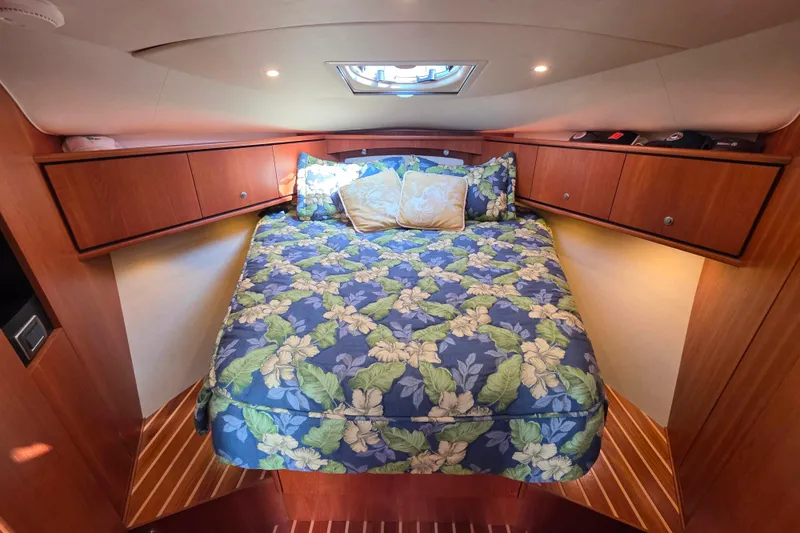 Living Benefit Yacht Photos Pics Luxurious cabin interior of 2007 Tiara Yachts 3900 Sovran with floral bedding.