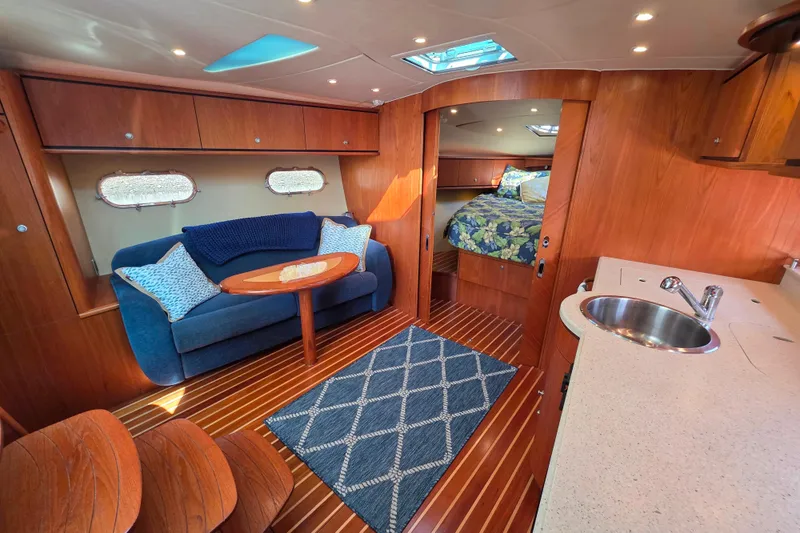 Living Benefit Yacht Photos Pics Luxurious 2007 Tiara Yachts 3900 Sovran interior with cozy seating and elegant wood finishes.