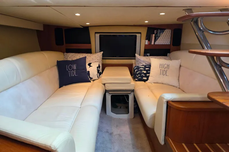 Living Benefit Yacht Photos Pics Luxurious interior of 2007 Tiara Yachts 3900 Sovran with cozy seating and nautical decor.