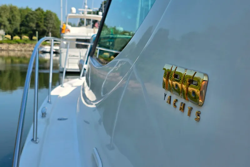 Living Benefit Yacht Photos Pics 2007 Tiara Yachts 3900 Sovran, close-up of logo on sleek white hull.