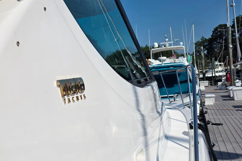 Living Benefit Yacht Photos Pics 2007 Tiara Yachts 3900 Sovran docked at marina, showcasing sleek design and logo.