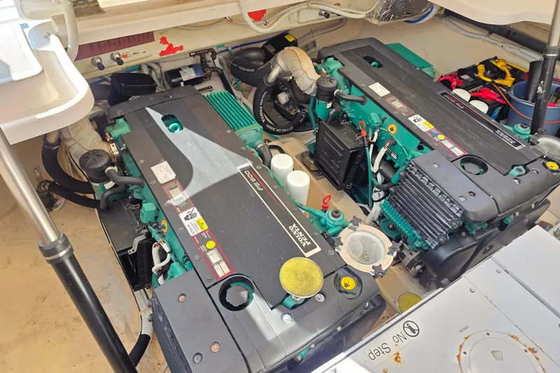 Living Benefit Yacht Photos Pics Engine room of 2007 Tiara Yachts 3900 Sovran, showcasing dual engines and mechanical components.