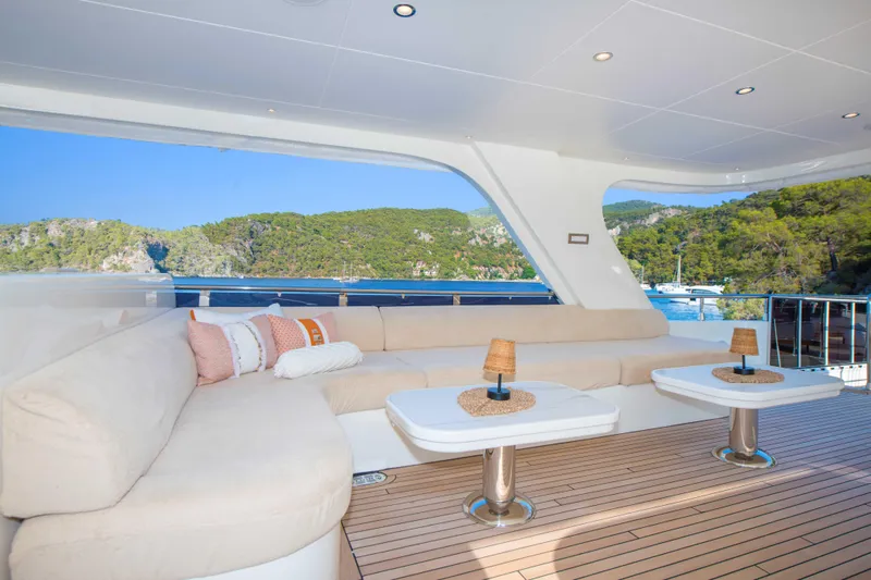 Ns02282 Yacht Photos Pics Luxurious 2023 Custom Motorsailer 41M yacht deck with plush seating and scenic ocean view.