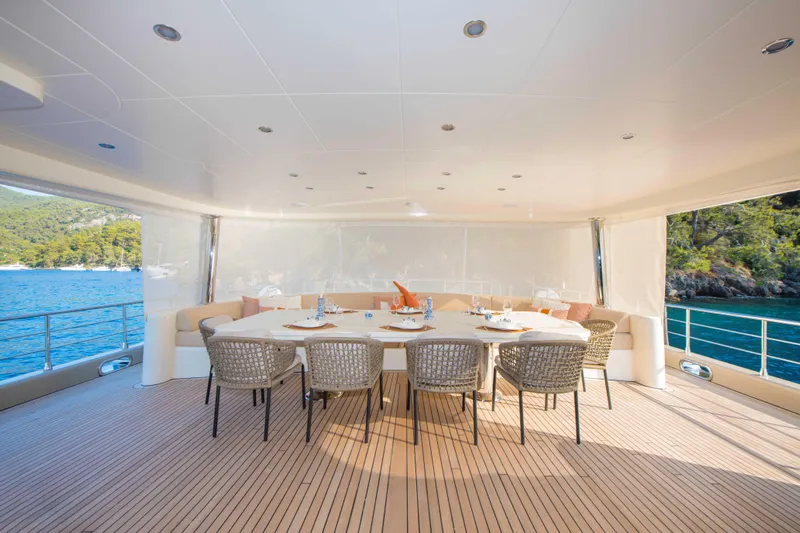 Ns02282 Yacht Photos Pics Spacious dining area on 2023 Custom Motorsailer 41M yacht, featuring elegant table setting and ocean view.