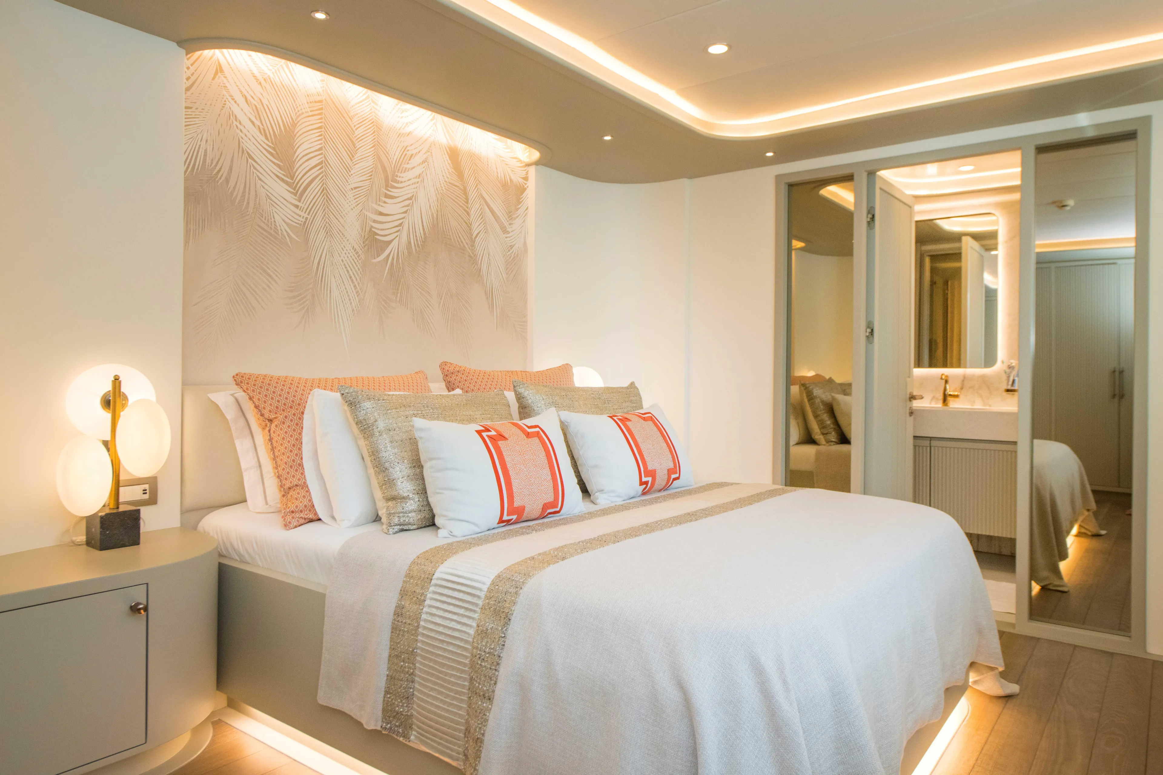 Ns02282 Yacht Photos Pics Luxurious bedroom on 2023 Custom Motorsailer 41M, featuring elegant decor and ambient lighting.