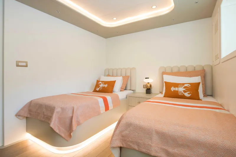 Ns02282 Yacht Photos Pics Twin bedroom on 2023 Custom Motorsailer 41M with modern decor and ambient lighting.