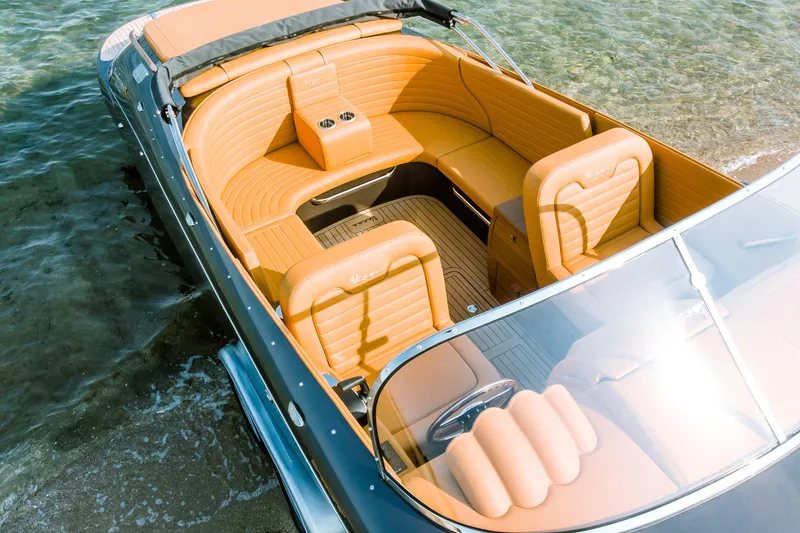 Seven Seas Speedster X Yacht Photos Pics 2025 Seven Seas Yachts Venus Speedster X with luxurious tan interior on clear water.