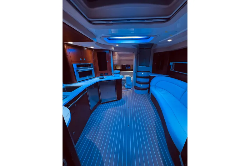 Lilley Pad Yacht Photos Pics Luxurious interior of 2007 Sea Ray 44 Sundancer yacht with modern amenities and blue lighting.