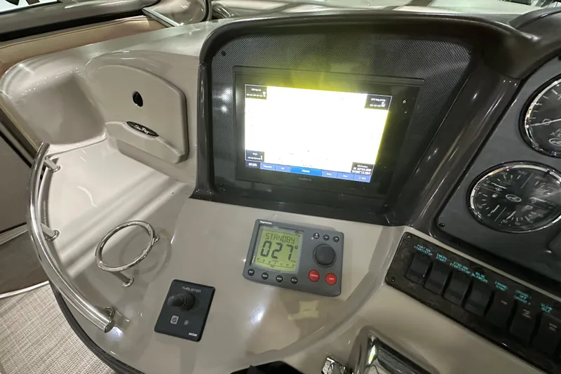 Lilley Pad Yacht Photos Pics 2007 Sea Ray 44 Sundancer helm with navigation display and controls.