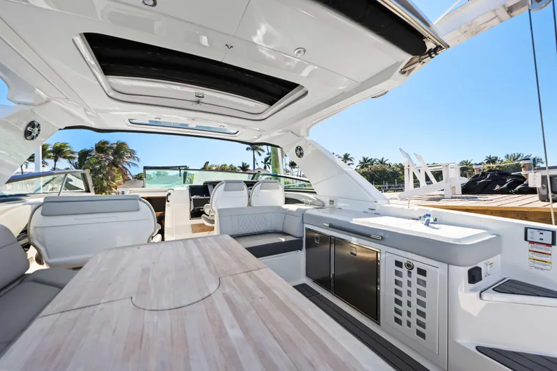  Yacht Photos Pics Luxurious 2023 Sea Ray SLX 400 Outboard interior with sleek seating and modern amenities.